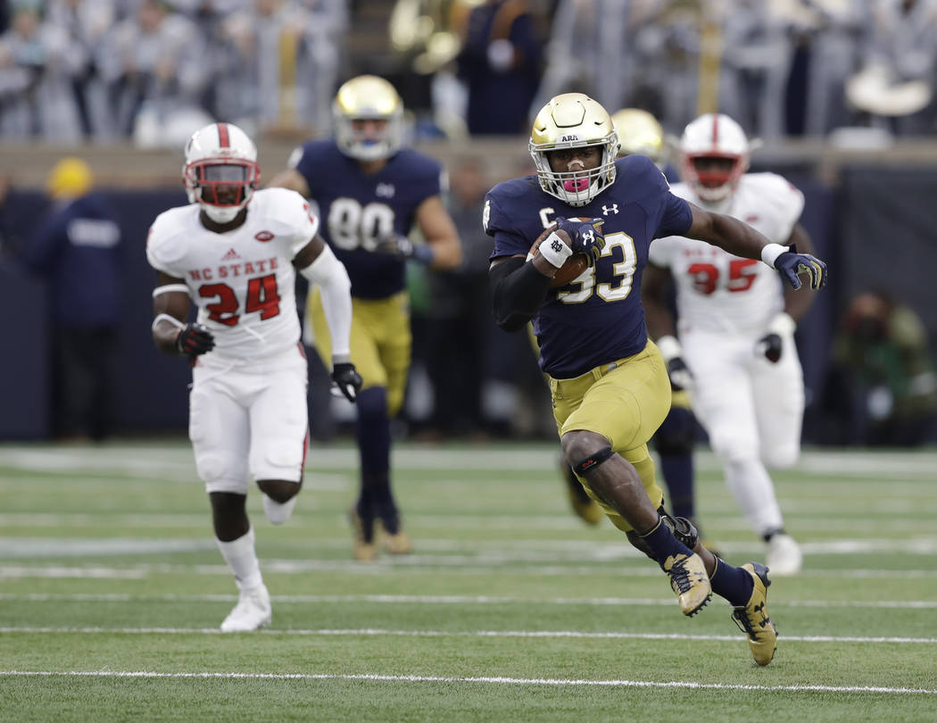 Notre Dame running back Josh Adams runs during the first half of an NCAA college football game against North Carolina State, Saturday, Oct. 28, 2017, in South Bend, Ind. (AP Photo/Darron Cummings)