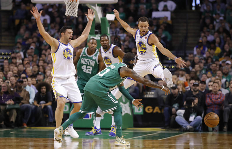 Nov 16, 2017; Boston, MA, USA; Boston Celtics guard Kyrie Irving (11) passes the ball as Golden State Warriors guard Stephen Curry (30) defends in the first quarter at TD Garden. Mandatory Credit: ...