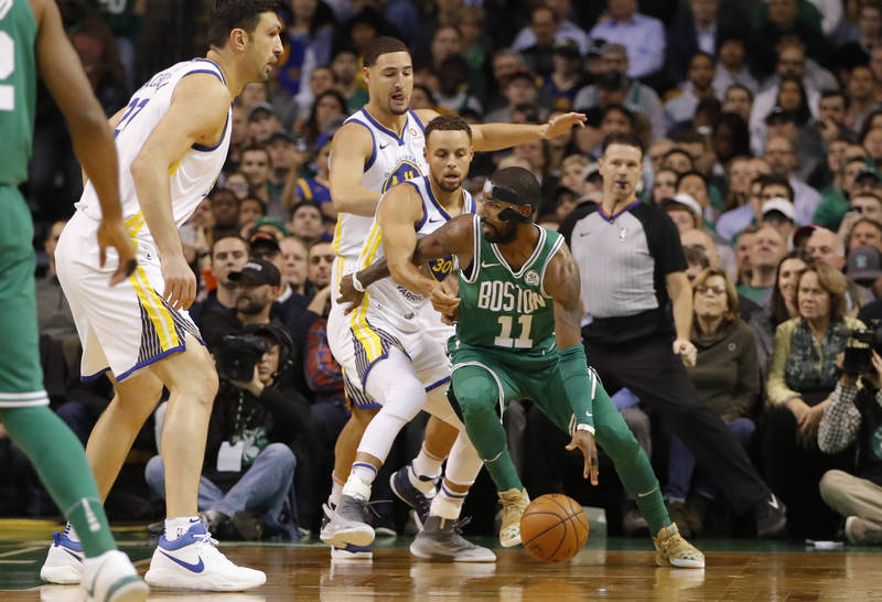 Nov 16, 2017; Boston, MA, USA; Boston Celtics guard Kyrie Irving (11) dribbles the ball as Golden State Warriors guard Stephen Curry (30) defends in the first quarter at TD Garden. Mandatory Credi ...