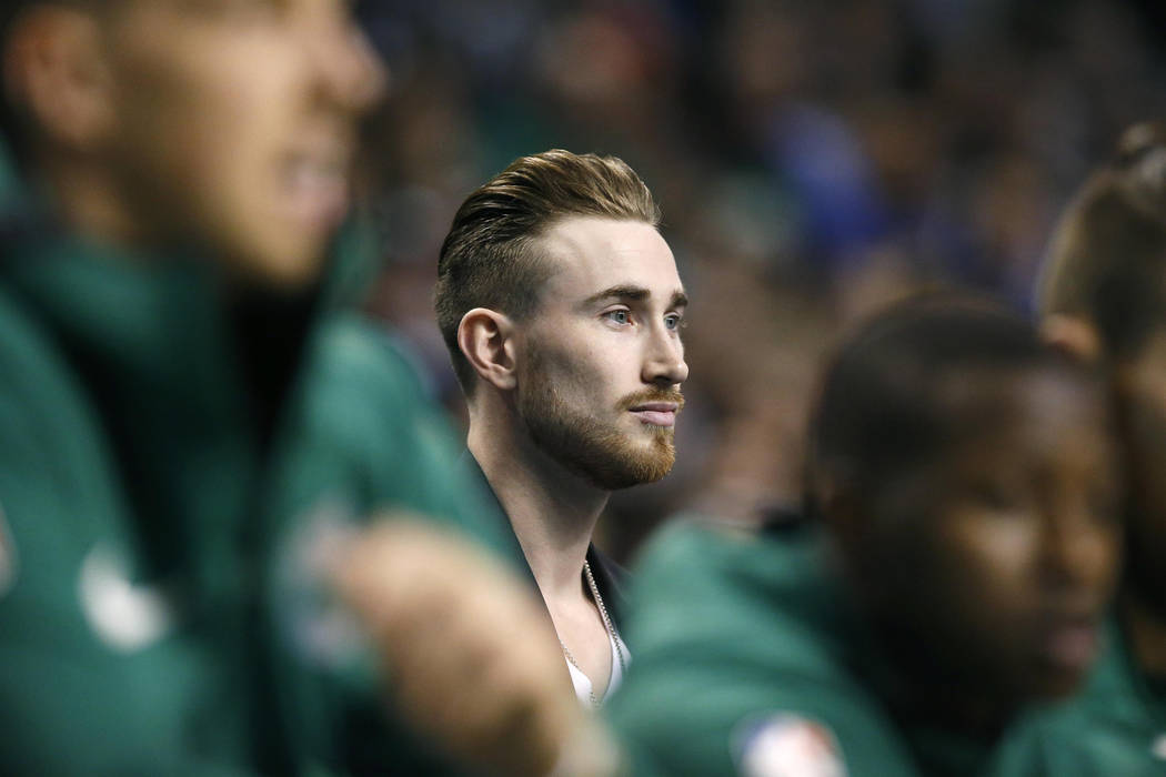 Boston Celtics' Gordon Hayward watches from behind the bench during the first quarter of an NBA basketball game against the Golden State Warriors in Boston, Thursday, Nov. 16, 2017. (AP Photo/Mich ...