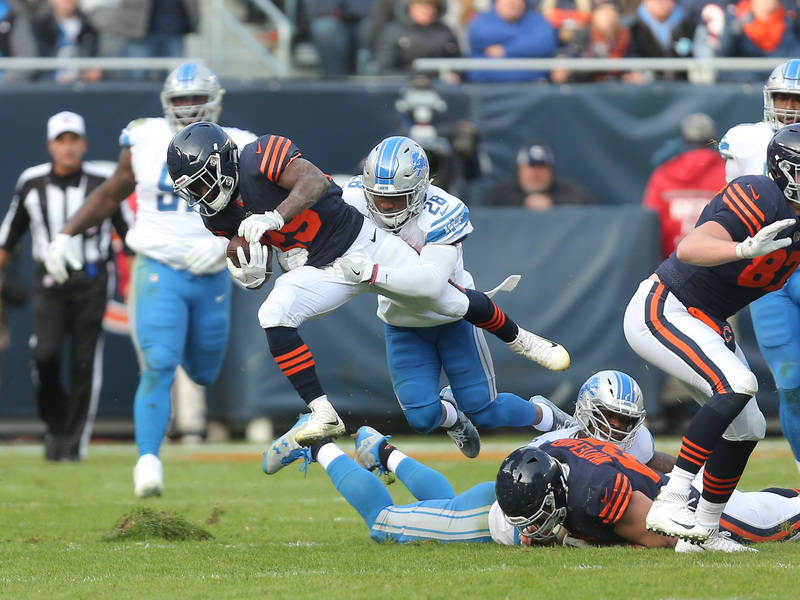 Nov 19, 2017; Chicago, IL, USA; Chicago Bears running back Tarik Cohen (29) runs with the ball with Detroit Lions cornerback Quandre Diggs (28) defending during the second half at Soldier Field. M ...