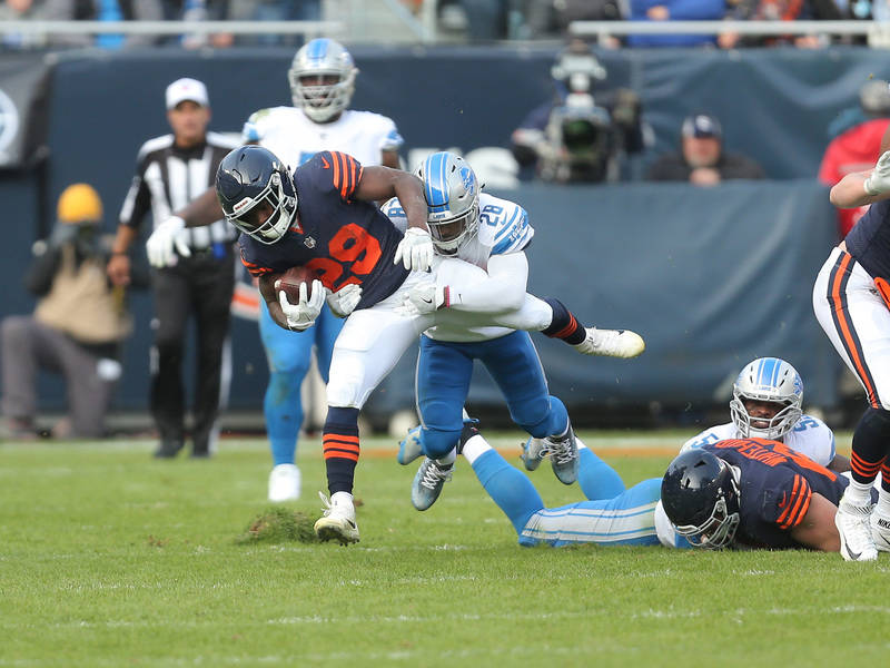 Nov 19, 2017; Chicago, IL, USA; Chicago Bears running back Tarik Cohen (29) is tackled by Detroit Lions cornerback Quandre Diggs (28) during the second half at Soldier Field. Mandatory Credit: Den ...