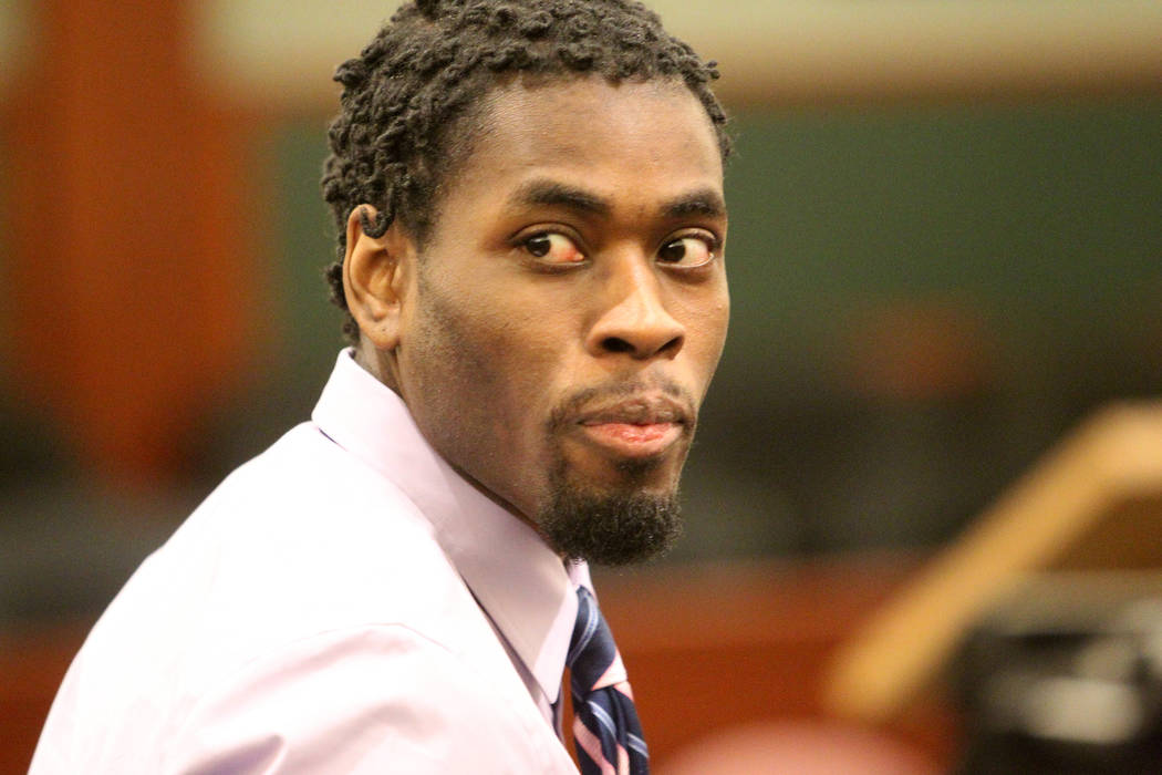 Bryan Clay glances into the gallery in the courtroom at the Regional Justice Center before bein ...