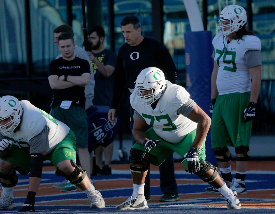 Oregon Ducks offensive lineman Tyrell Crosby (73) during a football practice at Bishop Gorman High School in Las Vegas, Wednesday, Dec. 13, 2017. Oregon Ducks and Boise State Broncos will meet on  ...