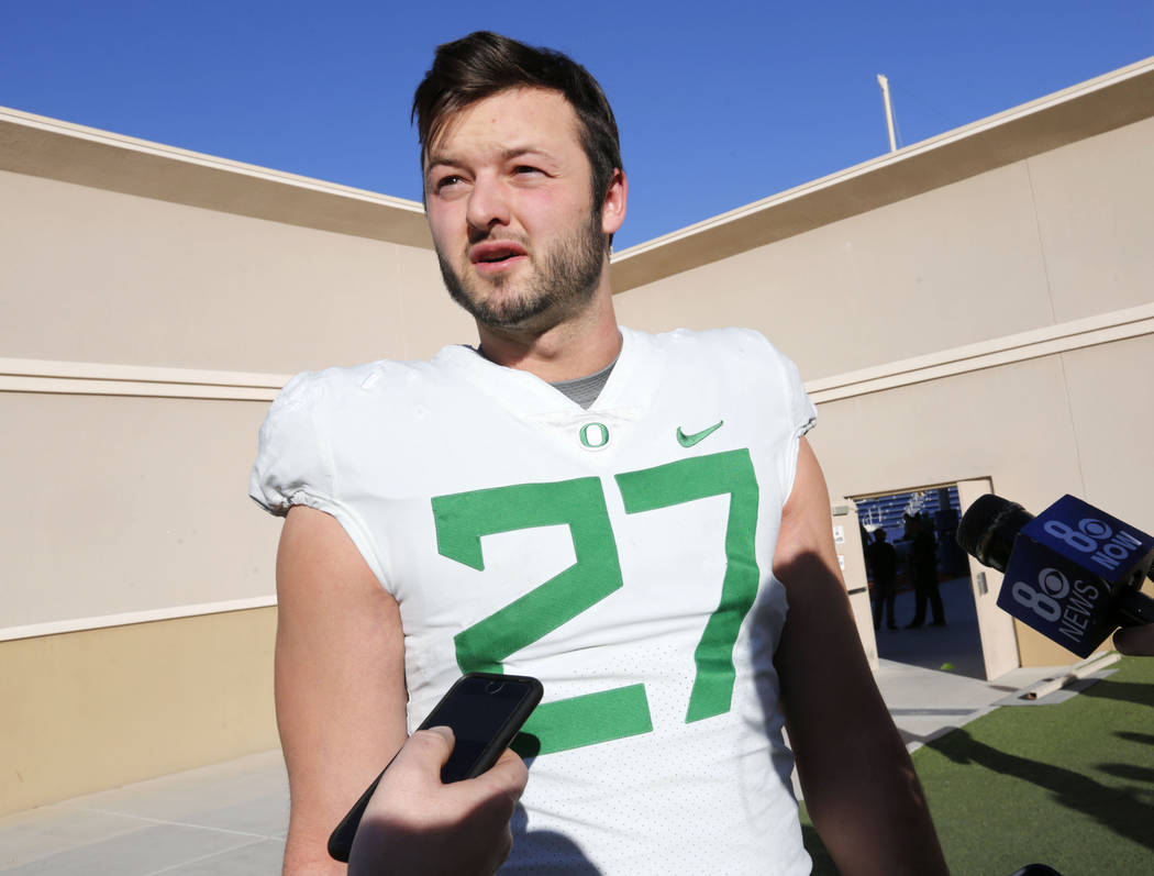 Oregon Ducks tight end Jacob Breeland (27) speaks to reporter before a football practice at Bishop Gorman High School in Las Vegas, Wednesday, Dec. 13, 2017. Oregon Ducks and Boise State Broncos w ...