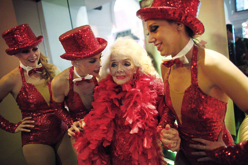 Former showgirl Gloria Mancilla, known as Gloria White, center, poses with Norma Wood, from left, Julie Langille, and Malory Huck, at her 90th birthday party at the Gold Diggers club at the Golden ...