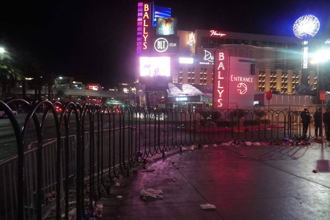 Trash from New Year’s Eve celebrations litters the Las Vegas Strip outside the CVS store near Harmon Avenue early Monday, Jan. 1, 2018. (Max Michor/Las Vegas Review-Journal)
