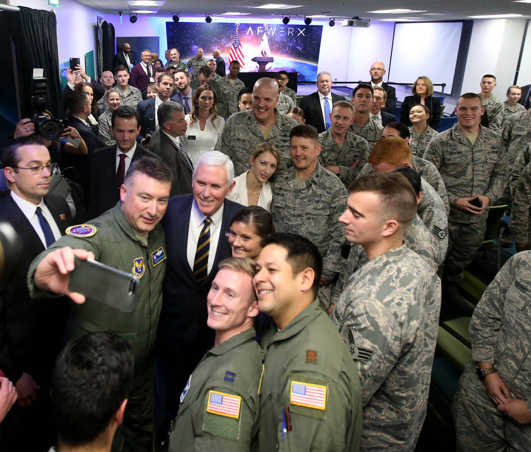 Lt. Col. Dave Hardin, left, takes a selfie with Vice President Mike Pence at the grand opening of AFWERX Vegas, a work space for the Air Force program that fosters entrepreneurial innovation engag ...