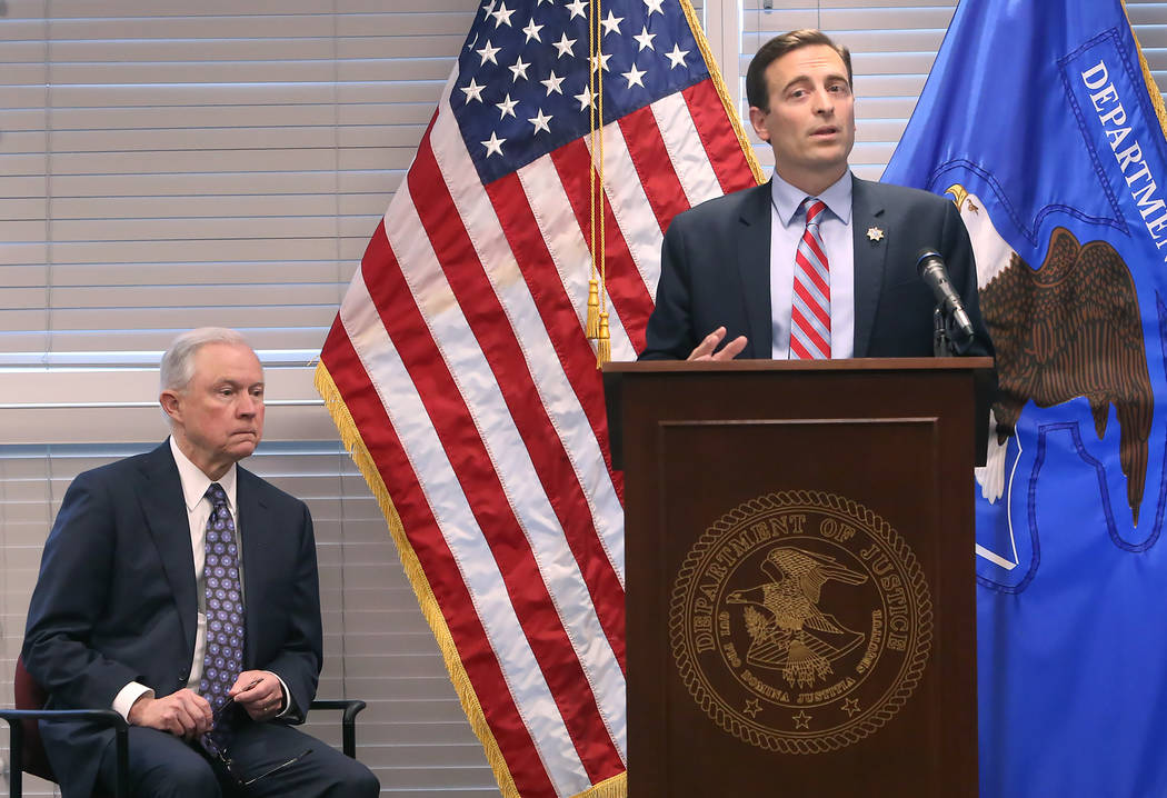U.S. Attorney General Jeff Sessions, left, introduced by Nevada Attorney General Adam Laxalt on Wednesday, July 12, 2017, at the U.S. attorney's office in Las Vegas. Sessions spoke to federal, sta ...