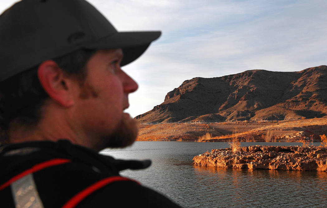 Southern Region Supervising Biologist Joe Barnes, 39, scans the sky for bald eagles at Lake Mea ...