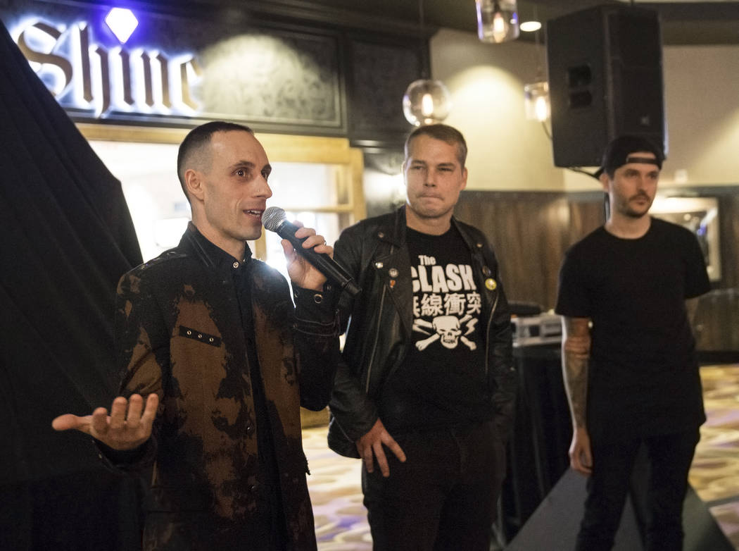 Sum 41 drummer Frank Zummo, left, artist Shepard Fairey and SJC co-founder Mike Ciprary address the crowd during the unveiling of custom a drumkit/art project called Rise Above on Friday, February ...