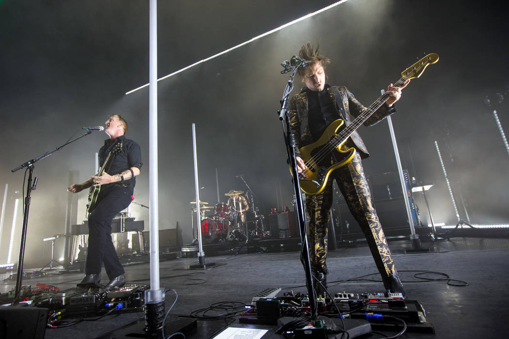Queens of the Stone Age frontman Josh Homme, far left, and bassist Michael Shuman, right, perform at The Chelsea at The Cosmopolitan of Las Vegas on Friday, Feb. 16, 2018. Chase Stevens Las Vegas  ...