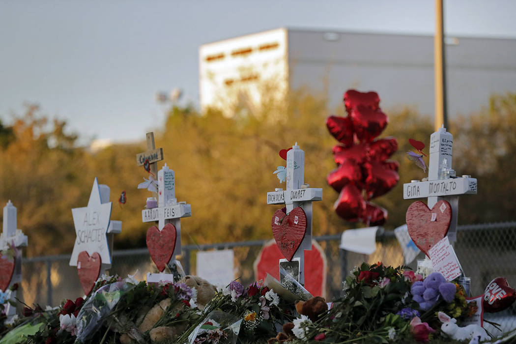 A makeshift memorial is seen outside the Marjory Stoneman Douglas High School, where 17 students and faculty were killed in a mass shooting on Wednesday, in Parkland, Fla., Monday, Feb. 19, 2018.  ...