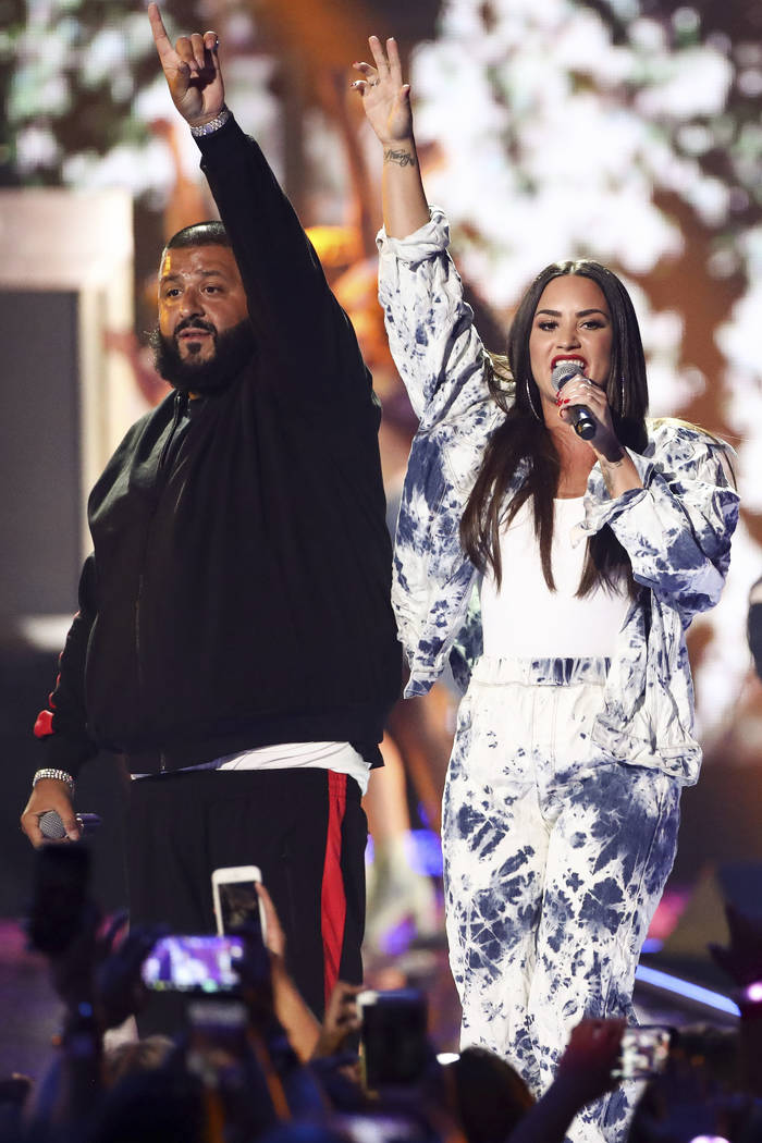 DJ Khaled, from left, and Demi Lovato perform at the 2017 iHeartRadio Music Festival Day 2 held at T-Mobile Arena on Saturday, Sept. 23, 2017, in Las Vegas. (Photo by John Salangsang/Invision/AP)