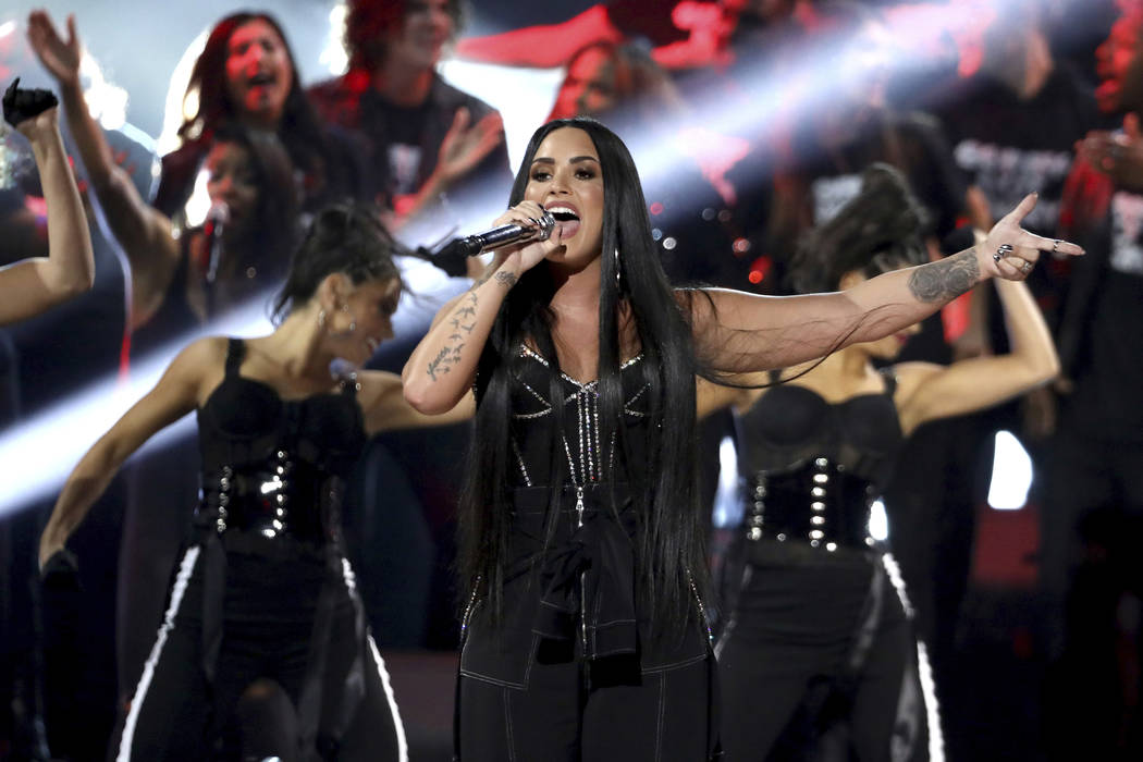 Demi Lovato performs "Sorry Not Sorry" at the American Music Awards at the Microsoft Theater on Sunday, Nov. 19, 2017, in Los Angeles. (Photo by Matt Sayles/Invision/AP)