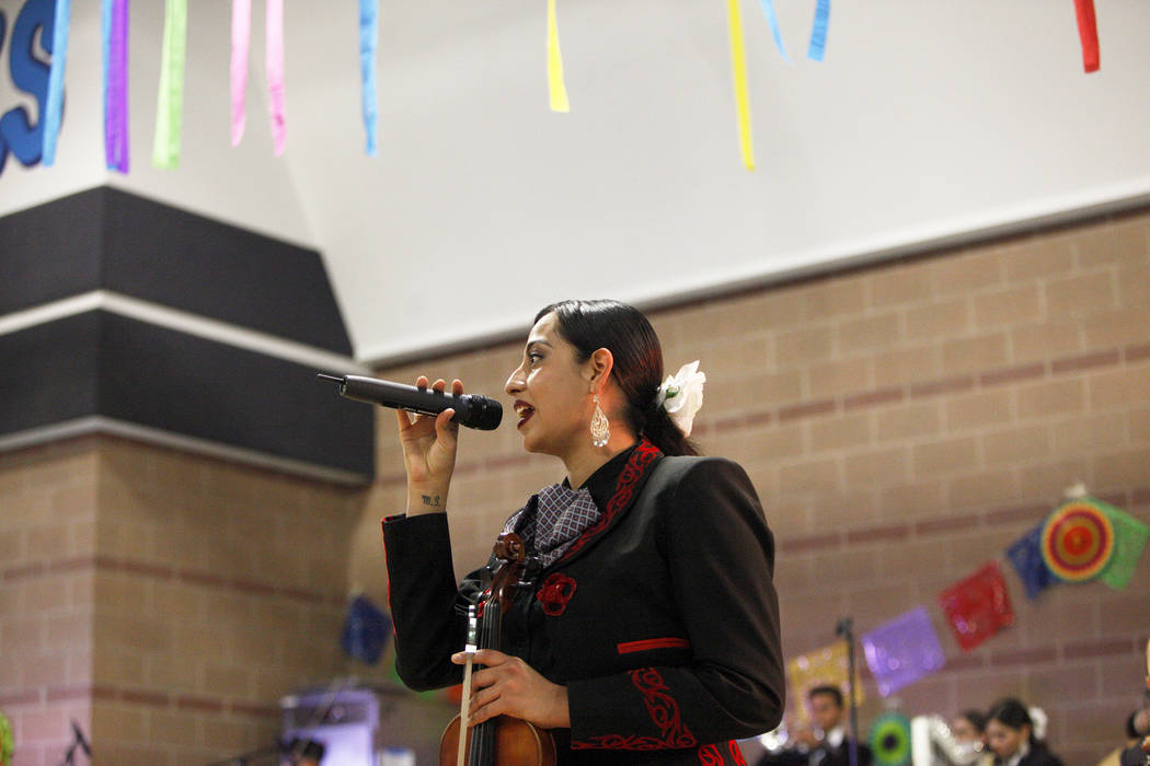 Yasmine Duenes sings as part of the Mariachi Herencia de Las Vegas at Canyon Springs High School in North Las Vegas, Friday, March 9, 2018. Different groups performed to benefit the high school's  ...
