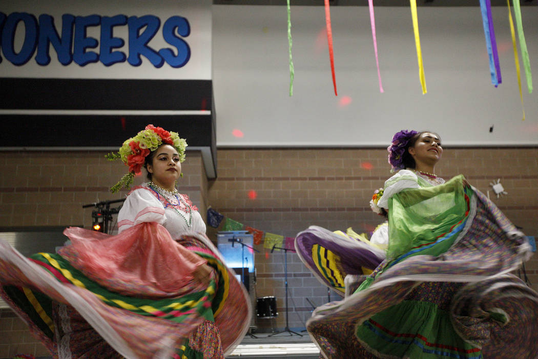 Stephanie Vasquez, 16, left, and Perla Murrieta, 16, perform Mexican folk dancing at Canyon Springs High School in North Las Vegas, Friday, March 9, 2018. They are in the high school's Mexican fol ...
