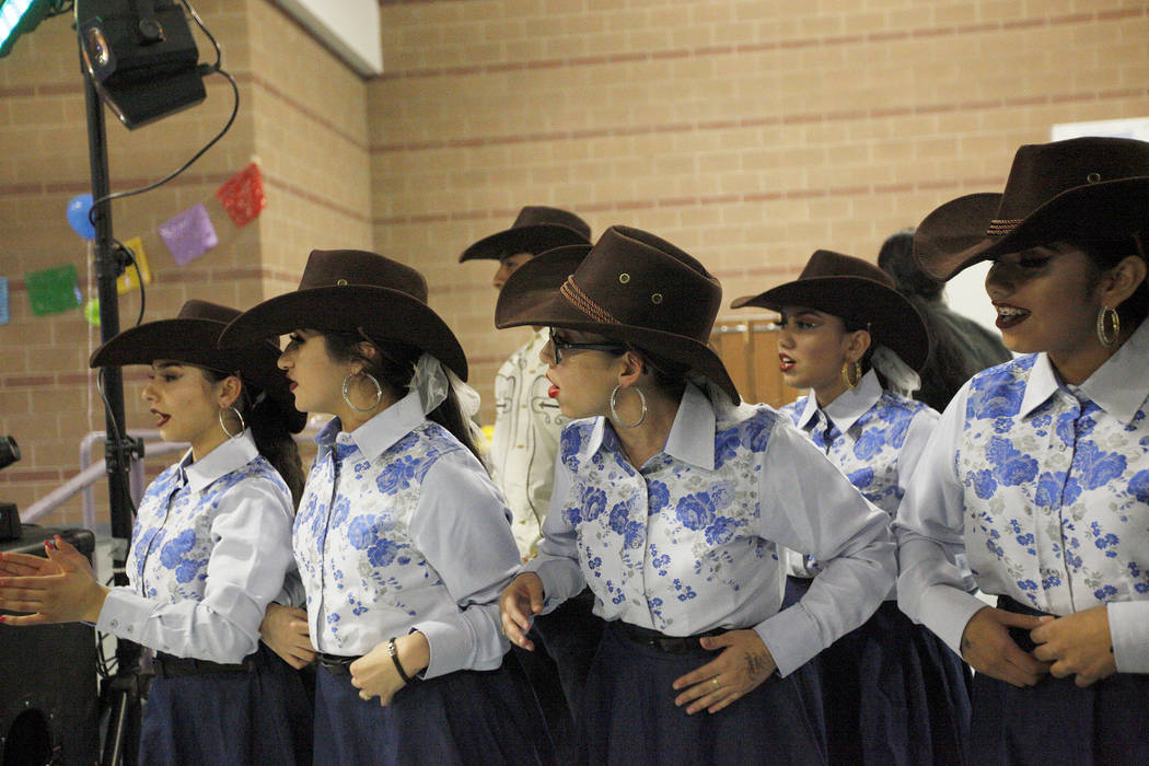 Members of Canyon High School's Mexican folk dancing program, Ballet Folkorico Del Caon, wait to perform at Canyon Springs High School in North Las Vegas, Friday, March 9, 2018. Different groups p ...