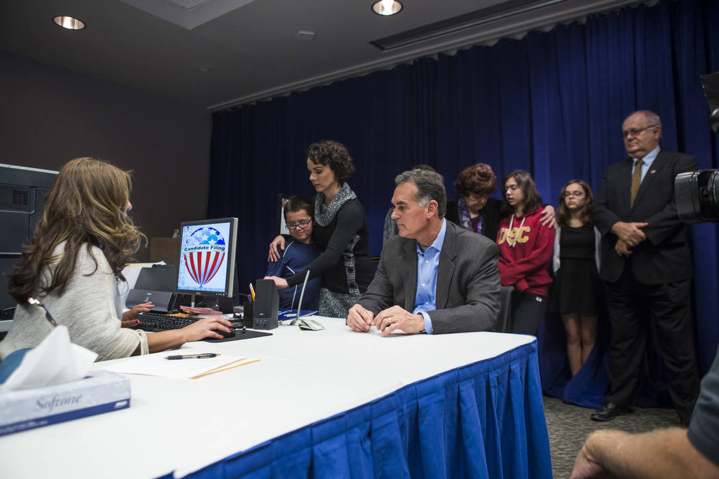 Danny Tarkanian files for his candidacy for the 3rd Congressional District of Nevada with his wife, Amy, left, their four children and his mother, Las Vegas City Councilwoman Lois Tarkanian, behin ...