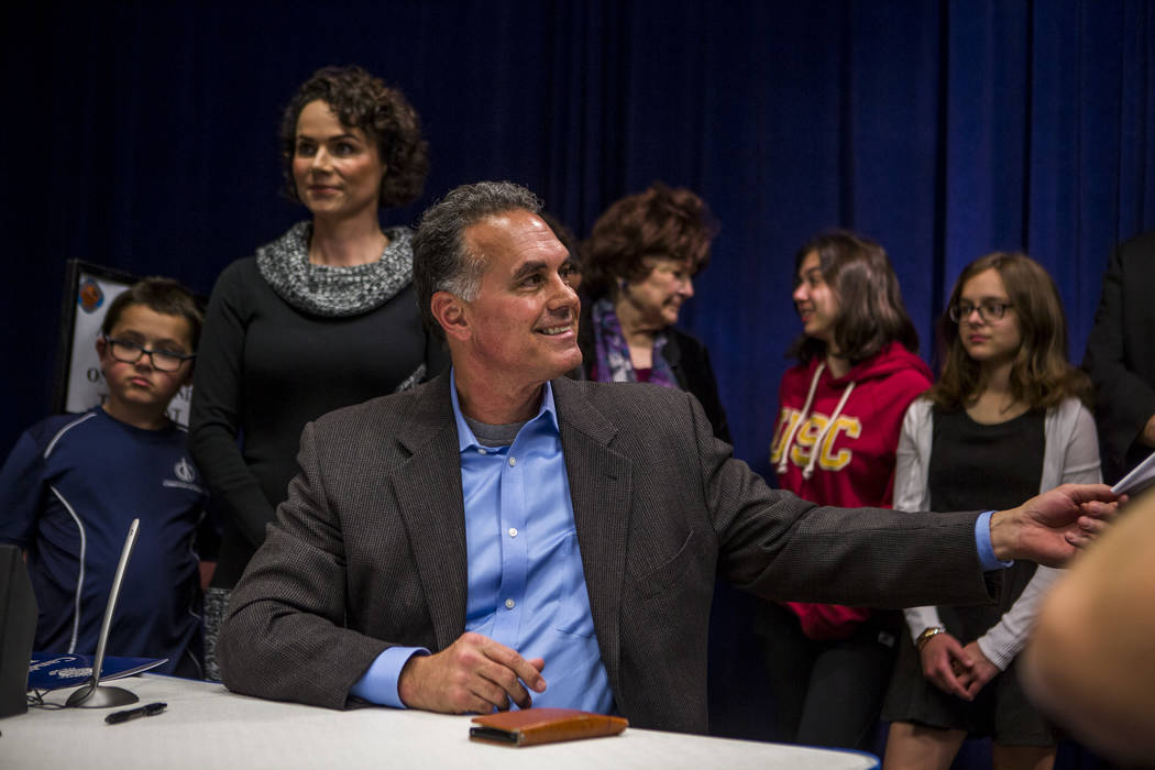 Danny Tarkanian files for his candidacy for the 3rd Congressional District of Nevada with his wife Amy, their four children and Las Vegas City Councilwoman Lois Tarkanian behind him at the Clark C ...
