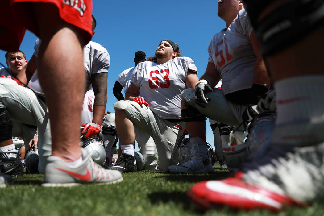 UNLV's offensive line Dylan Bryan (63) listens to one of the coaches before second quarter of UNLV's spring football game at the Peter Johann Memorial Field in Las Vegas on Saturday, April 14, 201 ...
