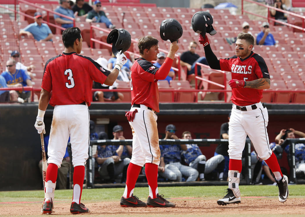 UNLV'S Nick Rodriguez (3), Dillon Johnson (25) and Kyle Isbel (5) celebrate after a run against Air Force during the sixth inning at the Earl Wilson Stadium in Las Vegas on Sunday, April 15, 2018. ...