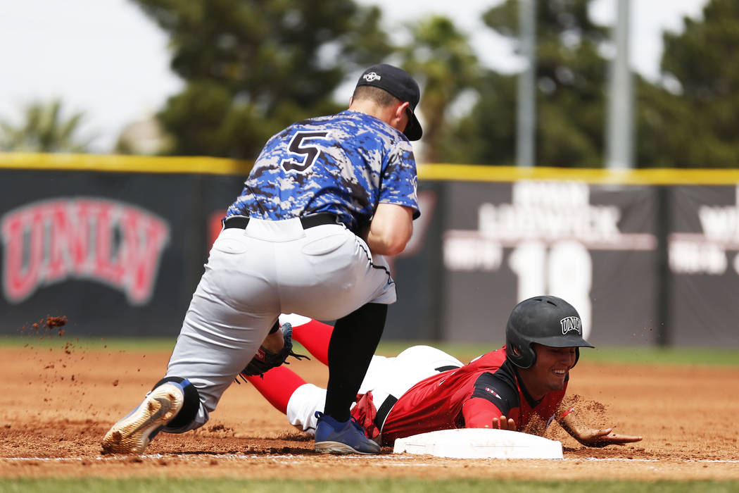 UNLV'S Dillon Johnson (25) dives safely back into first after a pick off attempt against Air Force's Nic Ready (5) during the second inning at the Earl Wilson Stadium in Las Vegas on Sunday, April ...