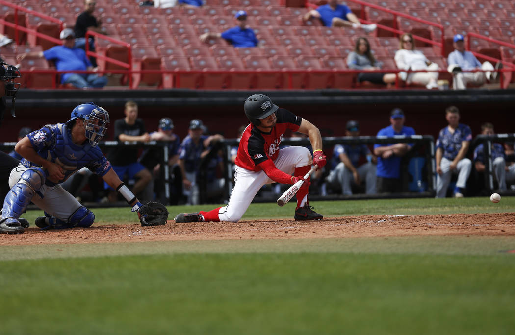 UNLV'S Grant Robbins (27) bunts the ball against Air Force during the second inning at the Earl Wilson Stadium in Las Vegas on Sunday, April 15, 2018. Andrea Cornejo Las Vegas Review-Journal @drea ...