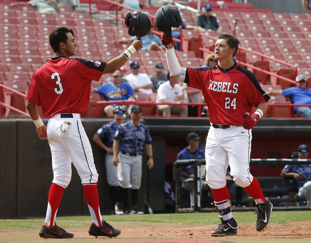 UNLV'S infielder Nick Rodriguez (3) and first baseman Nick Ames (24) celebrate a run against Air Force during the fifth inning at the Earl Wilson Stadium in Las Vegas on Sunday, April 15, 2018. An ...