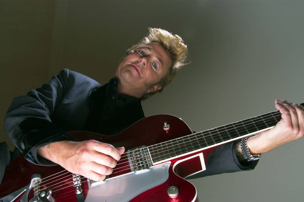 **FILE **Brian Setzer poses with his guitar in New York, in this Sept. 18, 2003, file photo. On "Wolfgang's Big Night Out," out in late September 2007, the Brian Setzer Orchestra gives a ...