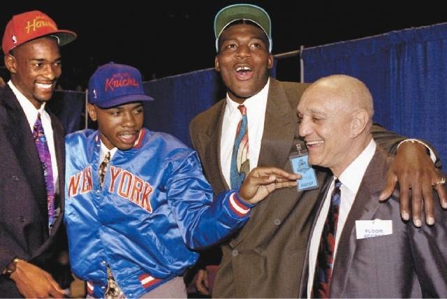 Larry Johnson, second from right, celebrates with UNLV teammates Stacey Augmon and Greg Anthony, and coach Jerry Tarkanian after all three players were selected in the first round of the 1991 NBA  ...