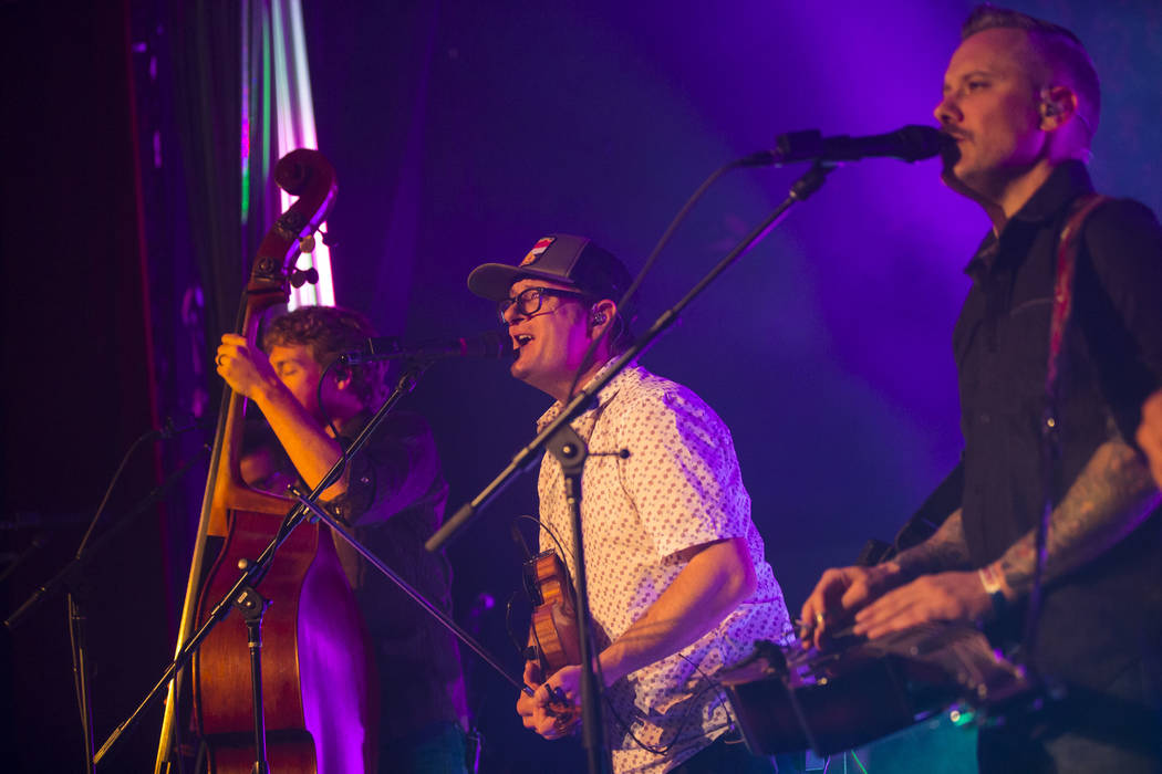 Jeremy Garrett, center, and Andy Hall, right, of The Infamous Stringdusters perform during the first night of the Bender Jamboree music festival at the Plaza in downtown Las Vegas on Thursday, Apr ...