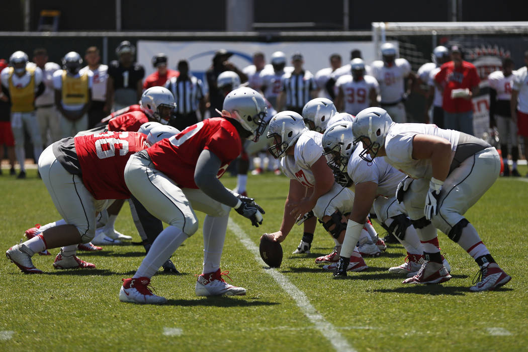 UNLV's football team prepare to snap the ball during first quarter of a spring game at the Peter Johann Memorial Field in Las Vegas on Saturday, April 14, 2018. Andrea Cornejo Las Vegas Review-Jou ...