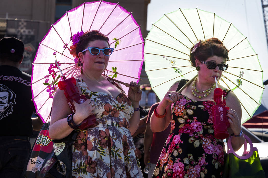 Carole Jensen, left, and Julie Murawski of Portland, Ore., don classic dresses and hold parasols at Viva Las Vegas at The Orleans on Saturday, April 21, 2018. Patrick Connolly Las Vegas Review-Jou ...