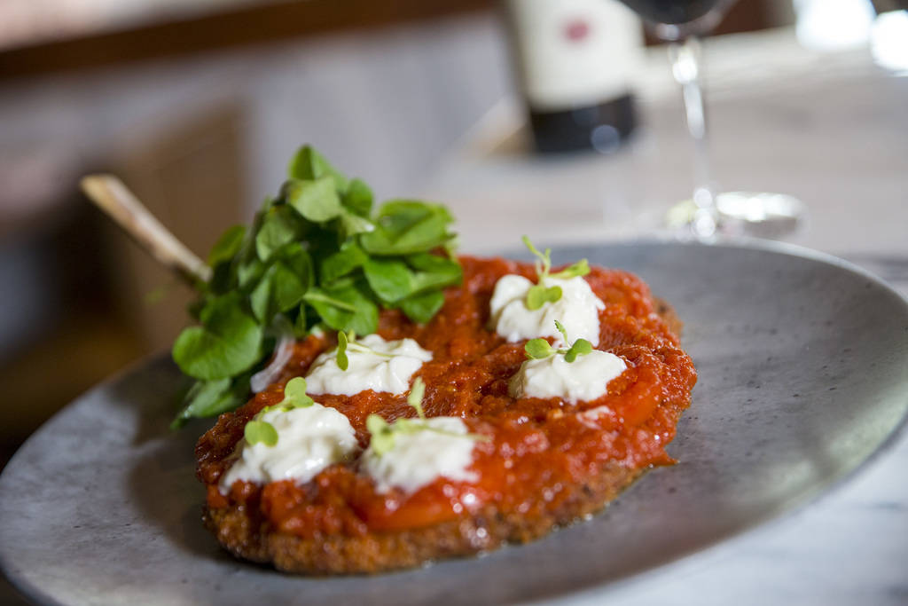 Veal chop parmigiana served with watercress, pickled onions, tomatoes and burrata cheese Masso Osteria inside Red Rock Casino in Las Vegas on Monday, May 21, 2018. Richard Brian Las Vegas Review-J ...