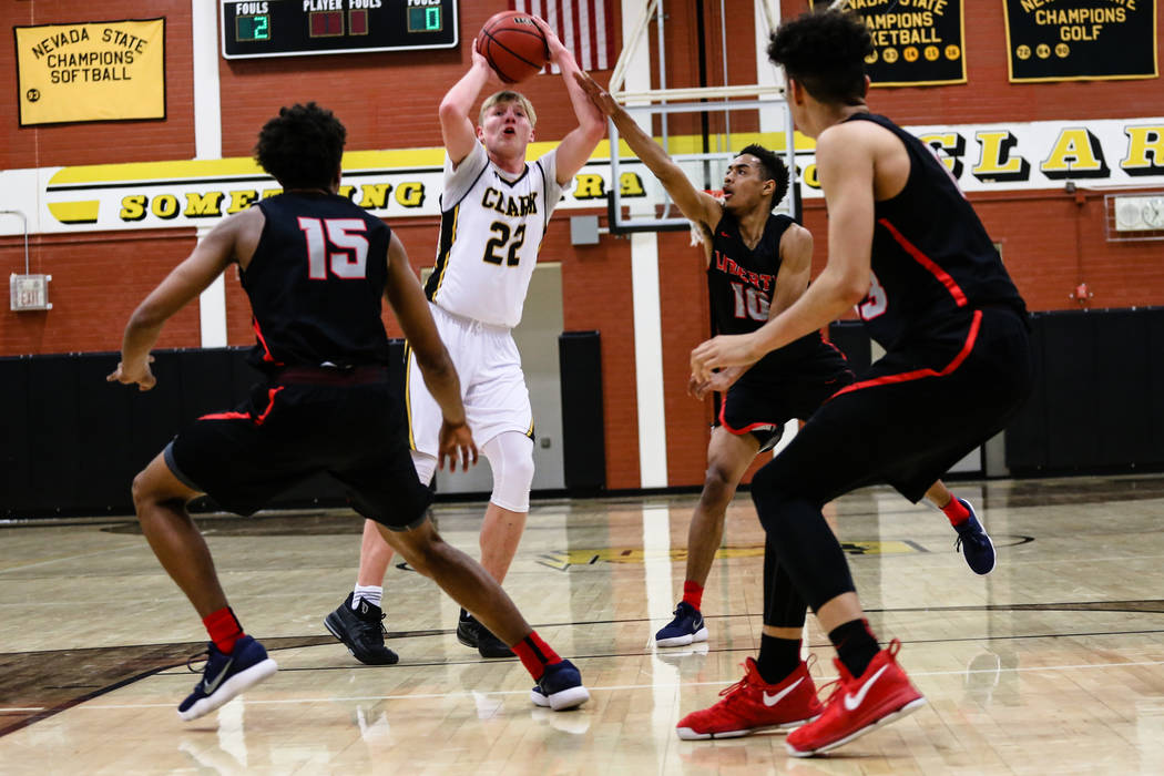 Clark Chargers' Trey Woodbury (22) prepares to pass the ball during the second quarter of a basketball game against Liberty at Ed W. Clark High School in Las Vegas, Friday, Dec. 15, 2017. Clark Ch ...