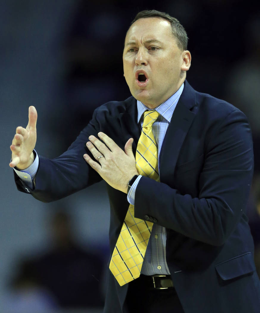 Northern Arizona head coach Jack Murphy directs his team during the first half of an NCAA college basketball game against Kansas State in Manhattan, Kan., Monday, Nov. 20, 2017. (AP Photo/Orlin Wa ...