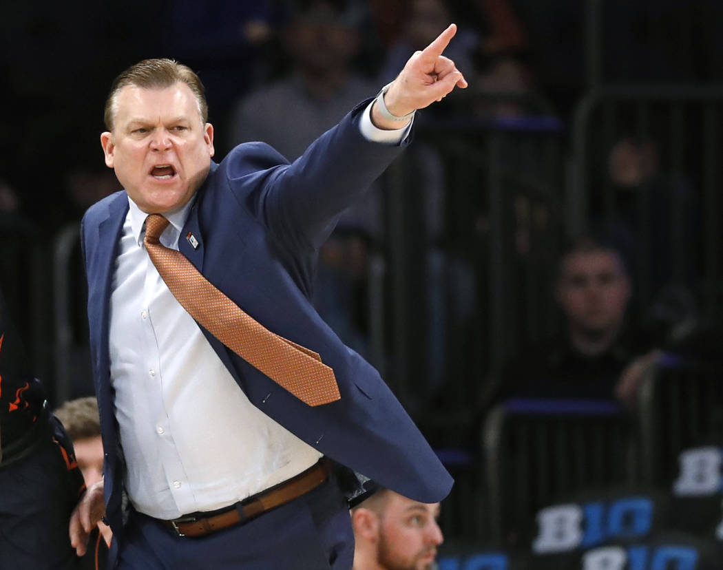 Illinois coach Brad Underwood gestures during the second half of the team's NCAA college basketball game against Iowa in the first round of the Big Ten men's tournament Wednesday, Feb. 28, 2018, i ...