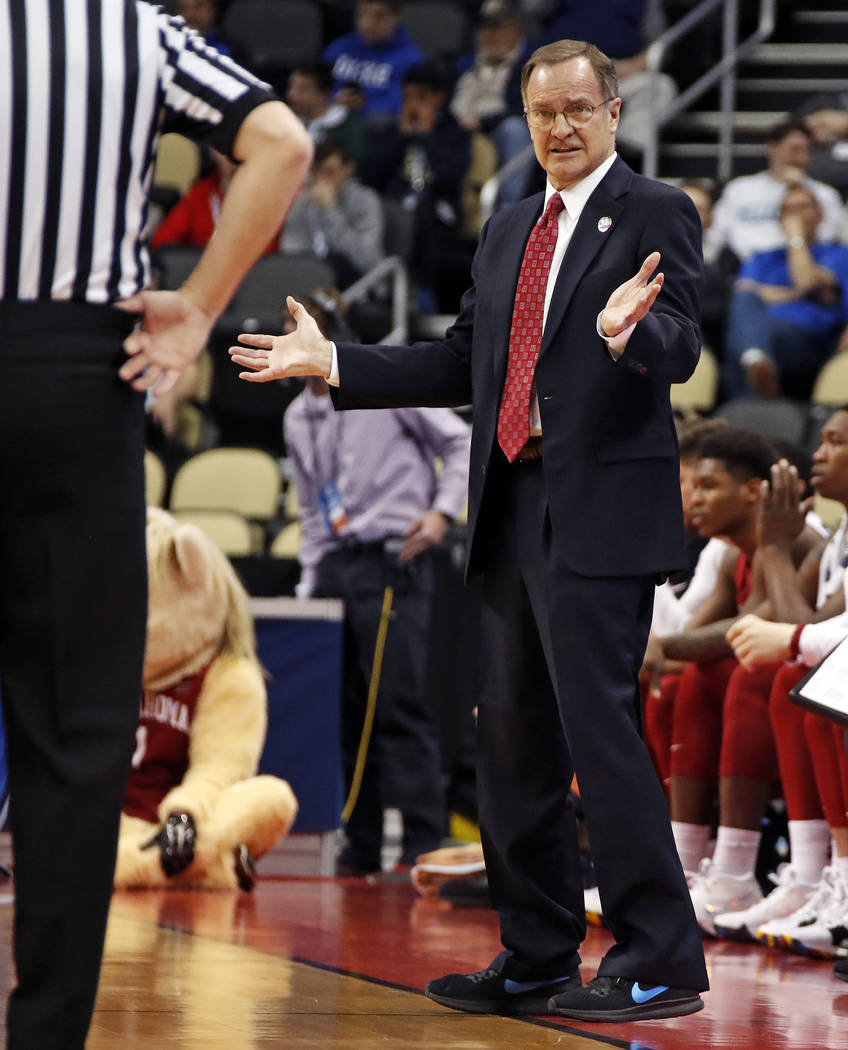 Oklahoma head coach Lon Kruger questions an official during the first half against Rhode Island in the first round of the NCAA men's college basketball tournament in Pittsburgh, Thursday, March 15 ...