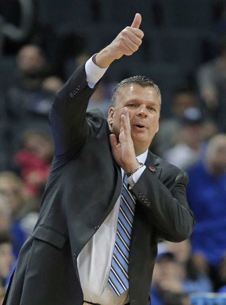 Creighton coach Greg McDermott directs his team against Kansas State during the first half of a first-round game in the NCAA men's college basketball tournament in Charlotte, N.C., Friday, March 1 ...