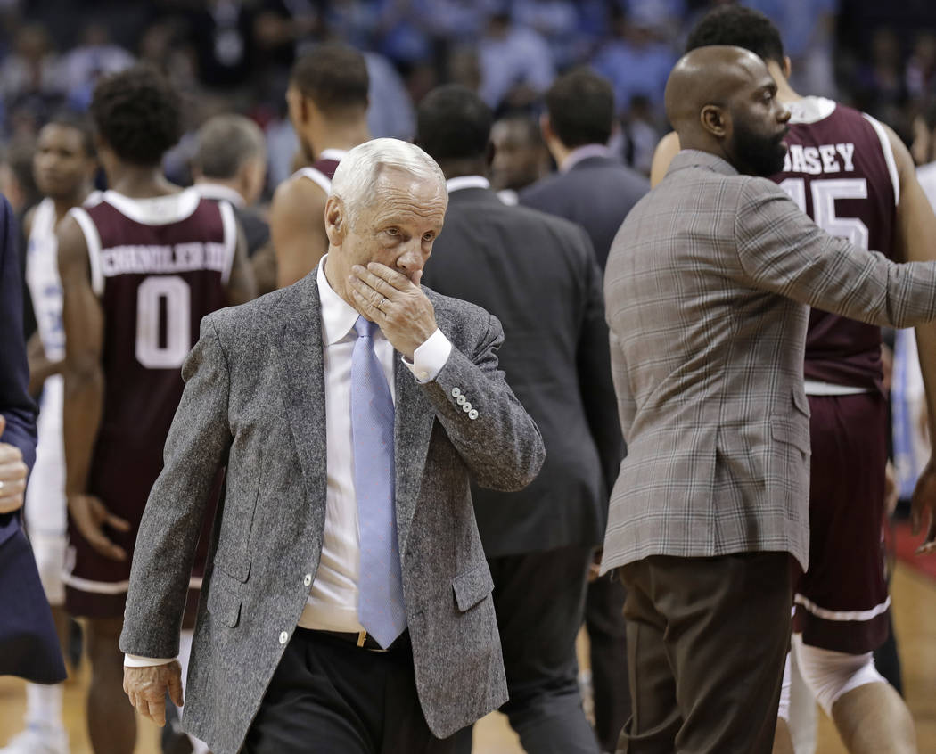 North Carolina head coach Roy Williams walks off the court after a second-round game against Texas A&M in the NCAA men's college basketball tournament in Charlotte, N.C., Sunday, March 18, 201 ...