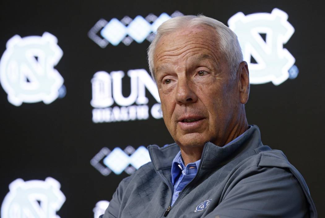North Carolina NCAA college basketball coach Roy Williams speaks with members of the media during a news conference in Chapel Hill, N.C., Tuesday, June 12, 2018. (AP Photo/Gerry Broome)
