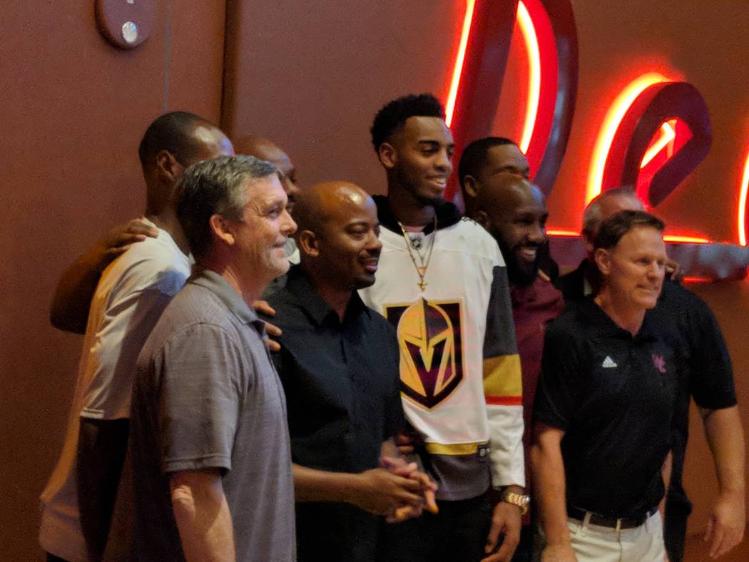 Former Centennial High School basketball star and Oregon Duck Troy Brown Jr., wearing a Golden Knights jersey, poses for a photo at Red Rock Resort after being drafted No. 15 overall by the Washin ...