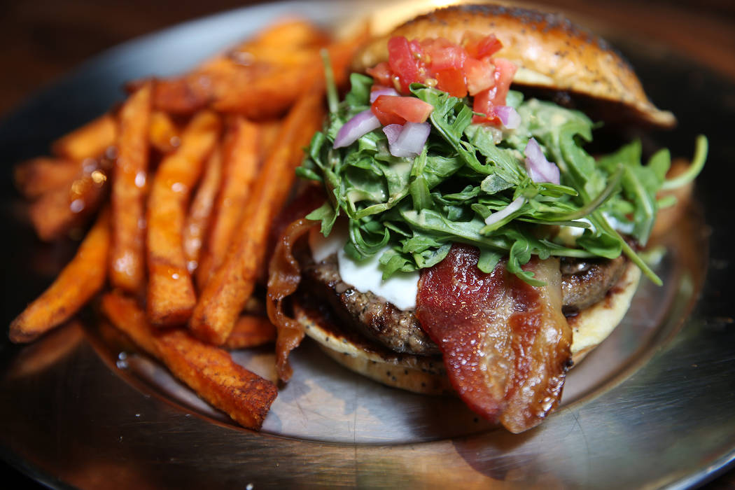 The Fresno Fig Burger, served with fig marmalade, melted goat cheese, bacon, tomato, red onion, arugula, and spicy porter mustard, at Eureka restaurant, 520 E. Fremont St., in Las Vegas, Wednesday ...