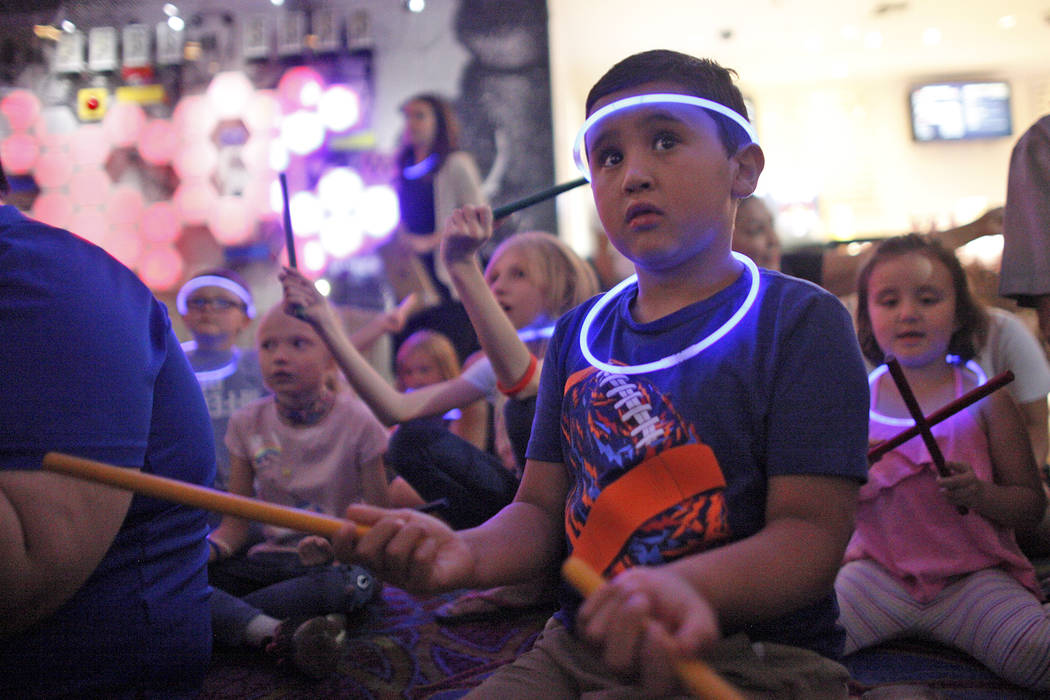Leo Murphy, 11, follows along during a drum circle activity at the Luxor hotel-casino in Las Vegas, Sunday, June 10, 2018. The event took place before the Blue Man Groups' Grant a Gift Autism Foun ...