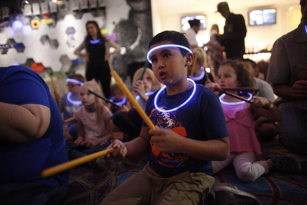 Leo Murphy, 11, follows along during a drum circle activity at the Luxor hotel-casino in Las Vegas, Sunday, June 10, 2018. The event took place before the Blue Man Groups' Grant a Gift Autism Foun ...