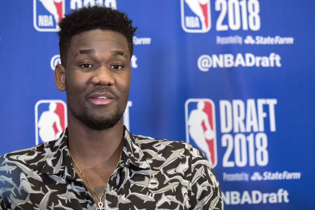 Arizona's DeAndre Ayton speaks to reporters during a media availability with the top basketball prospects in the NBA Draft, Wednesday, June 20, 2018, in New York. (AP Photo/Mary Altaffer)