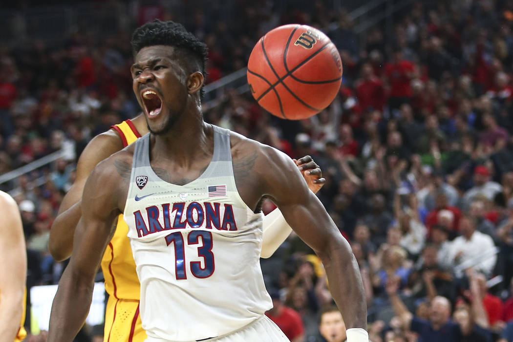 Arizona Wildcats forward Deandre Ayton (13) celebrates his dunk over the USC Trojans during the Pac-12 tournament championship basketball game at T-Mobile Arena in Las Vegas on Saturday, March 10, ...