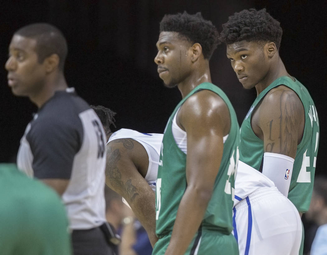 Celtics center Robert Williams, right, waits for a Philadelphia player to shoot a free throw during Boston's game with the 76ers during NBA Summer League on Friday, July 6, 2018, at the Thomas &am ...