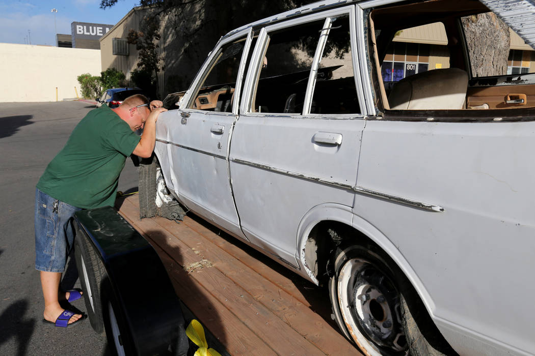 Michael Wiley Blackburn of Hartford, Wis. gets his first look of a car that belonged to his fat ...